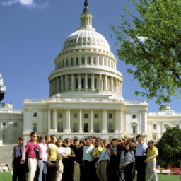 A color photograph of a group of people standing in front of the United States Capitol building.