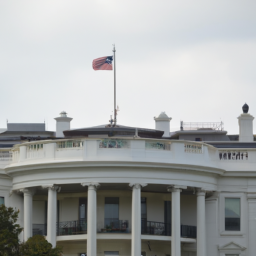 Description: A picture of the White House and the US flag flying proudly above it.