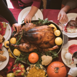 description: an anonymous image depicting a festive thanksgiving table adorned with a beautifully roasted turkey, assorted side dishes, and a cornucopia filled with autumnal fruits and vegetables. people of different ages and backgrounds are gathered around the table, expressing joy and gratitude.