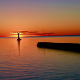 description: an anonymous image captures a splendid sunset in st. peter's bay, showcasing the vibrant colors of the sky reflecting on the calm waters. the serene atmosphere is enhanced by the silhouette of a distant sailboat and the outline of a lighthouse on the horizon.