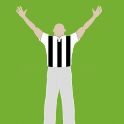 A person in a prison uniform standing in front of a green background with their arms raised in the air.