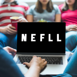description: a group of people sitting together, engrossed in a movie on a laptop screen, with the netflix logo clearly visible.