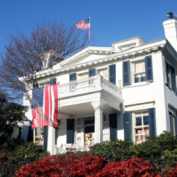description: a photo of the white house with the american flag flying on top.