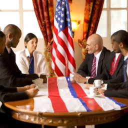 A group of people in suits gathered around a table in a room with American flags in the background.
